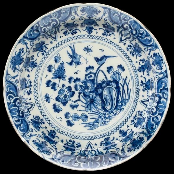 Blue and white porcelain plate painted with birds and flowers